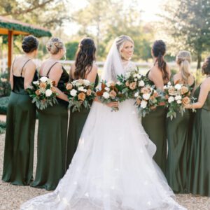 Back view of the bride and bridesmaid with flowers