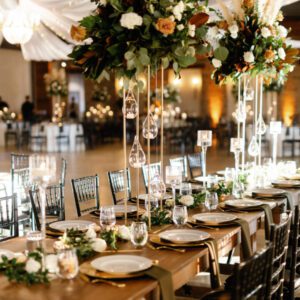 A long shot of the dinner table decorated with flowers and cutlery