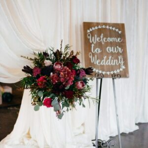 A picture of the wooden welcome board for wedding