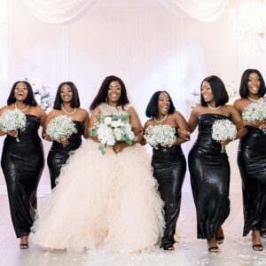 A picture of the bride and bridesmaid in black and white gowns