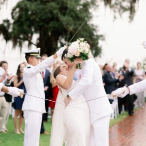 A picture of the couple kissing each other on their wedding